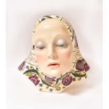 LENCI; a hand painted bust of a young woman in floral headscarf, by Helen Konig Scavini, marked to