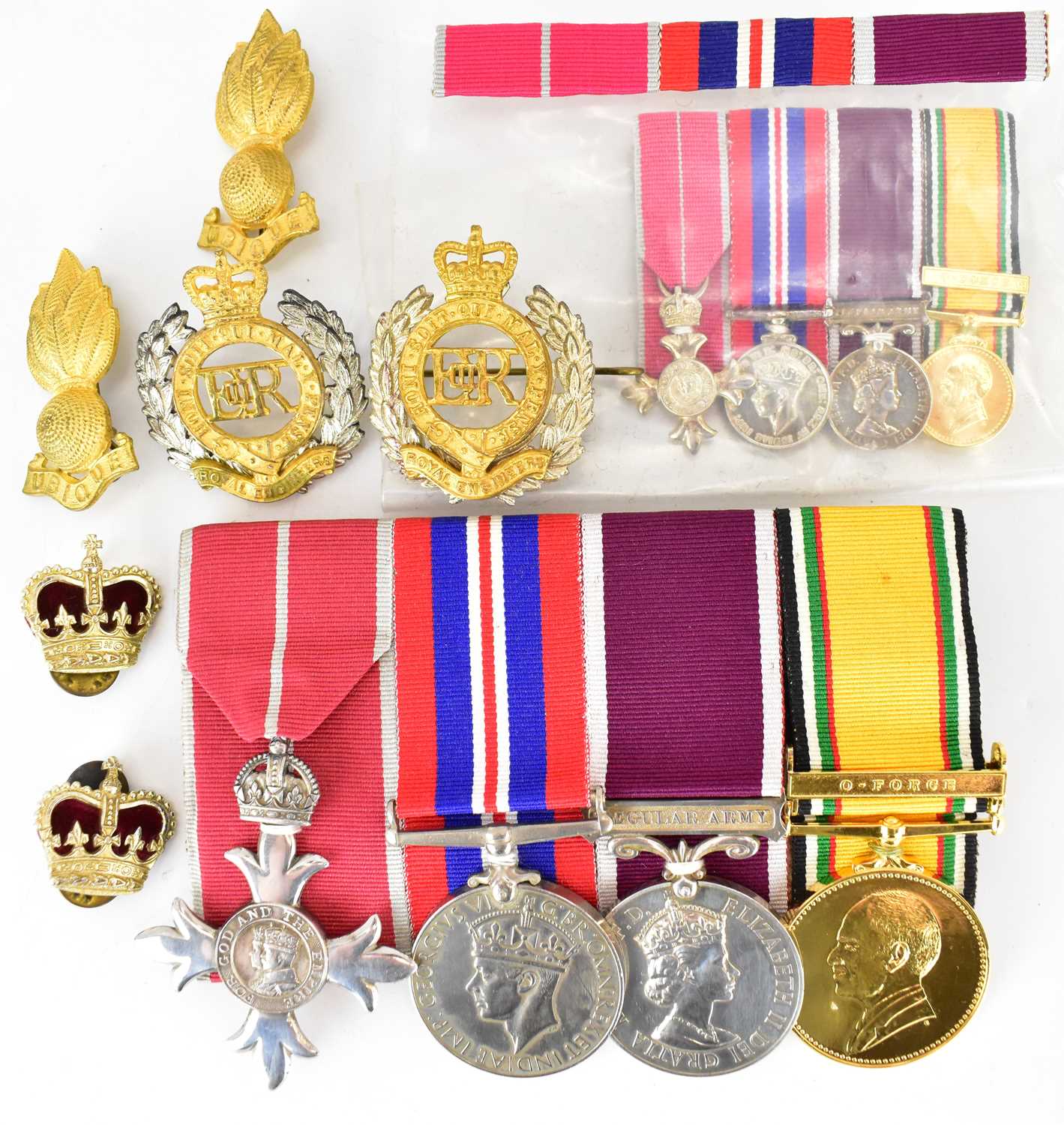 A group of four medals comprising an OBE and ribbon, a George VI War Medal, Elizabeth II 'Long