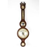 A Victorian mahogany banjo barometer with silvered dial, level gauge to the bottom, thermometer