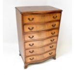 A reproduction mahogany six-drawer bow front chest, raised on short bracket feet, 102 x 68 x 46cm.