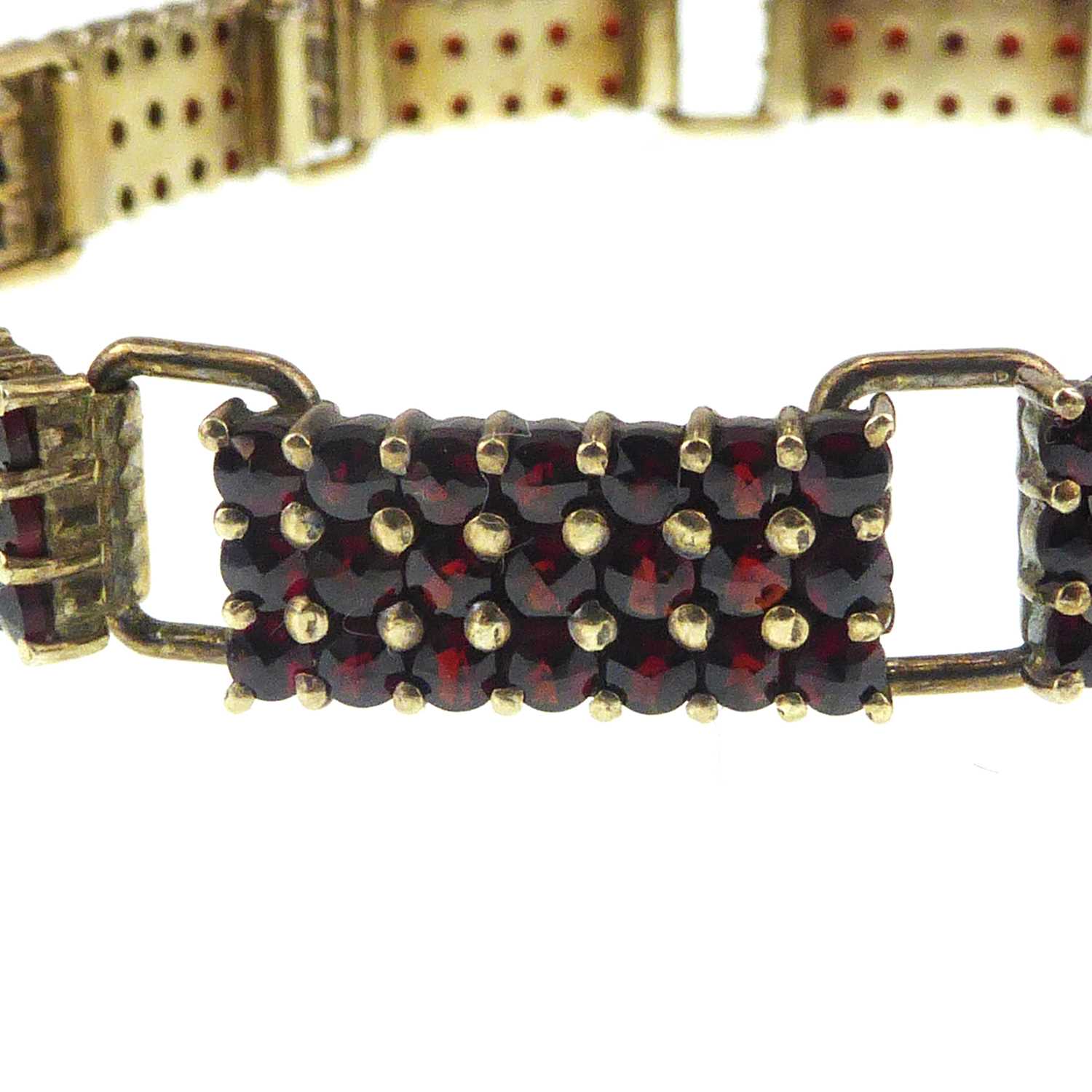 A Continental gilt silver (835 grade) garnet cluster bracelet comprising ten panels of twenty-one - Image 2 of 3