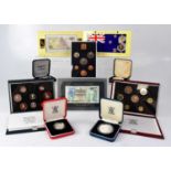 A collection of commemorative coins, including proof sets, individual silver coins, also a