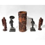 A 20th century Chinese carved bamboo brush pot, height 28.5cm, a pair of carved wooden figures and a