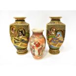 A pair of mid-20th century Japanese square baluster vases with figures, gilt-heightened throughout