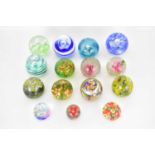 Fifteen small floral inset glass paperweights (15).