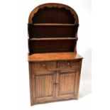 A reproduction oak dresser with domed rack, width 95cm.