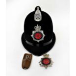 An Elizabeth II Greater Manchester Police helmet, badge and a 'Detective' whistle (3).