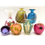 Seven pieces of coloured art glassware, comprising an opaque and enamelled vase with frilled edge