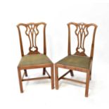A set of six Chippendale-style mahogany dining chairs with drop-in seats and square stretchered