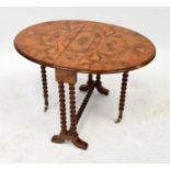A small Victorian burr walnut gateleg table with ball turned supports and cross stretcher, brass