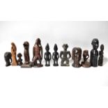 A group of predominantly African contemporary carved wooden figures and busts.