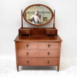 An Edwardian mahogany oval mirror back dressing table with two short and two long drawers, 158 x 105