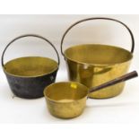 Two brass and steel jam pans, diameters 33.5cm and 26cm, together with a brass saucepan with tapered