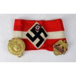 A German Third Reich WWII period armband set with enamelled badge, a Third Reich belt buckle