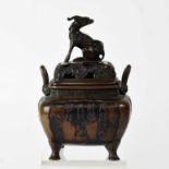 A Japanese Meiji period bronze koro and cover, with pierced domed lid, high loop handles and