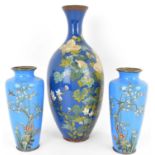 A pair of blue cloisonné vases of tapered form, depicting cherry blossoms and small birds to the