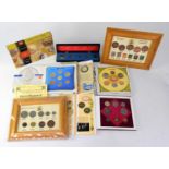 A collection of commemorative coin sets and wallets.