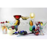 A quantity of decorative coloured glass including a bottleneck vase, ashtray, shell moulded vase,