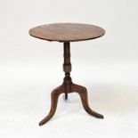 A George III oak tilt-top tripod occasional table, height 63.5cm.