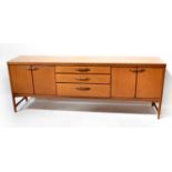 NATHAN; a 1960s teak sideboard with three graduated central drawers flanked by a pair of cupboard