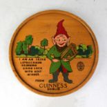 GUINNESS; a mid-20th century circular tray decorated with a leprechaun and inscribed 'From Guinness,