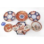 A group of Meiji period and later Imari palette ceramics to include a pair of decorative plates with