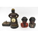 Two cast metal reproduction 'Jolly Gentlemen' money boxes, together with a metal figural clock in