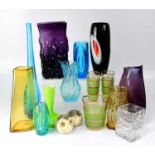 A collection of decorative glassware including mid-century coloured glass vases, lemonade set, etc.