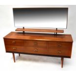 A 1970s mirror back teak dressing table with six short drawers, on tapering legs, 110 x 142 x 41cm.