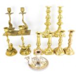 Five pairs of vintage and antique brass candlesticks, to include a pair with dolphin stem and square