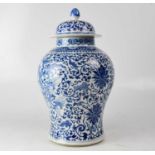 A large late 19th century Chinese blue and white baluster jar and cover, with painted six-