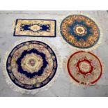 Four small modern Chinese rugs with blue and red grounds (4).