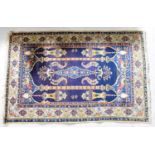 An Iranian Kashan blue ground hand-knotted rug with Mosque patterns, 210 x 133cm.