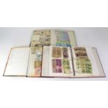 Three albums of world banknotes, mainly mid/late 20th century, including Japan, the Caribbean,