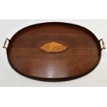 A large Edwardian oval tray with central inlaid shell, brass handles and raised sides, 60 x 45cm.