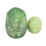 Two Egyptian-style composite and plaster hieroglyphic scarab beetles, the largest 6.5cm, the