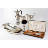 A large collection of silver plate including tea set, entrée dishes and covers, etc.