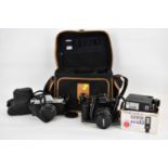 A Rolleiflex SL35 35mm SLR camera lens in case, a Canon EOS 500 35mm camera, various lenses,