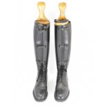 A pair of early 20th century cavalry officer's black leather riding boots with lace-up fronts,