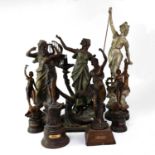 A group of spelter figures including an Art Deco style lamp with opaque glass shade, height of