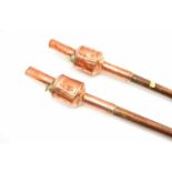 A pair of 19th century handheld or carriage mounting torches with copper and brass paraffin font and
