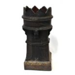 A salt glazed chimney stack with castellated top, on square section plinth, height 74cm.