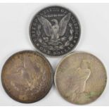 Three USA silver dollars comprising 1896 Morgan (no mint mark), 1904 Morgan (O - New Orleans Mint