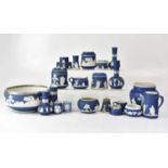 A quantity of dark blue Wedgwood jasperware including various bowls, vases, pots, jugs, etc.