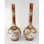 A pair of mid-19th century Japanese Satsuma bottle form vases, painted with panels of figures on a