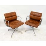 CHARLES AND RAY EAMES FOR HERMAN MILLER; two brown leather and cast aluminium swivel office