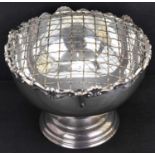 An Elizabeth II hallmarked silver rose bowl, with wire mesh top and floral scalloped border, to