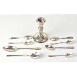 A small quantity of silver items, comprising a chamber stick with loaded base, various spoons