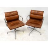 CHARLES AND RAY EAMES FOR HERMAN MILLER; four brown leather and cast aluminium swivel office chairs,