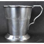 A George V hallmarked silver cup of conical form and flanged foot rim, inscribed, 'Colin Andrew